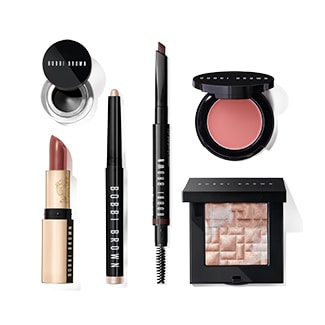 group shot of lipstick, eyeshadow stick, gel eyeliner, brow pencil, cream blush and highlighting powder