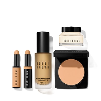 group shot of concealer stick, corrector stick, liquid foundation, face primer, and face powder